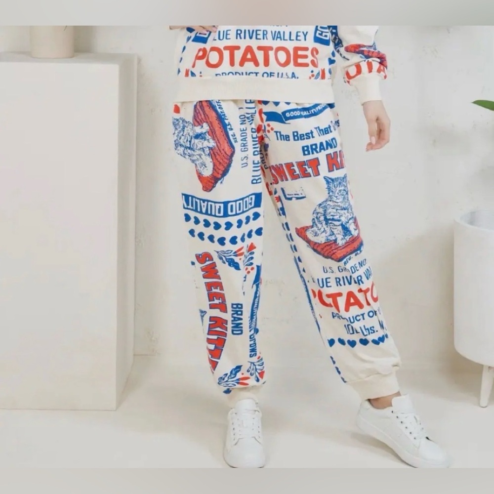 NWT Graphic Cream Sweatpants with Red & Blue Print